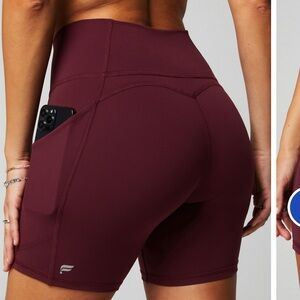 Fabletics Oasis PureLuxe medium high waisted shorts 6 inch inseam merlot biker